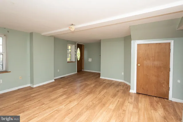 a view of an empty room and window