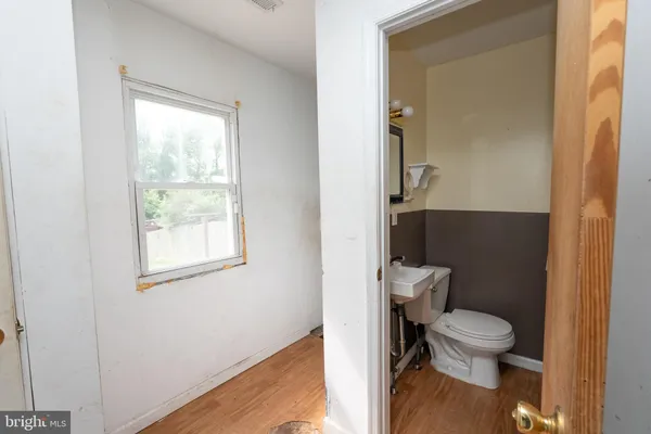 a bathroom with a toilet and a sink