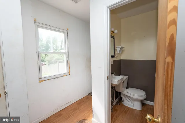 a bathroom with a toilet and a sink
