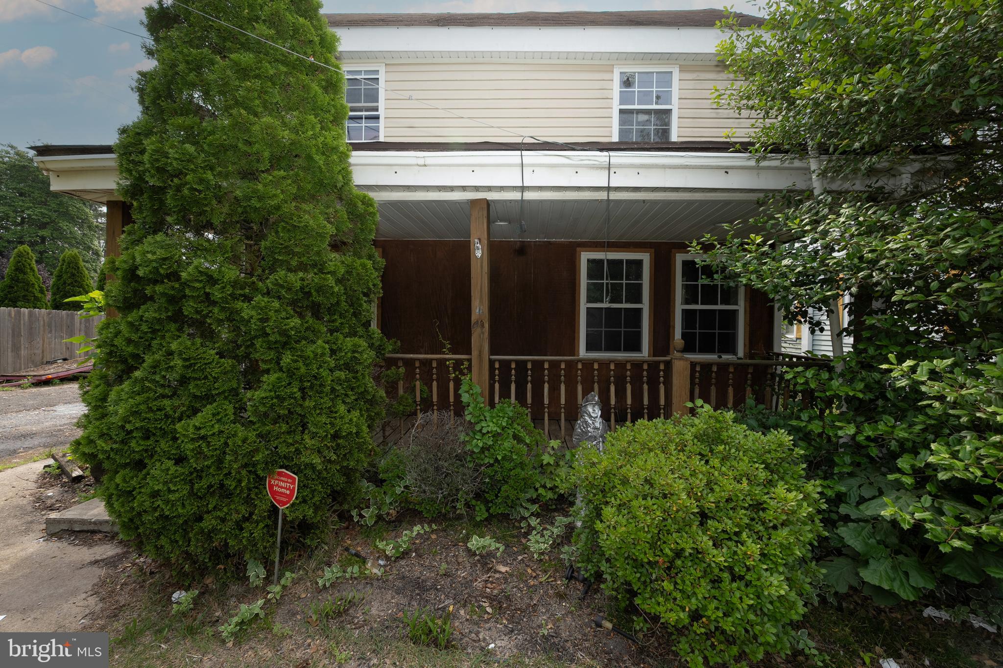 33 Clementon Road West Gibbsboro, NJ 08026 - Photo 5 of 47 a view of a house with potted plants and a tree