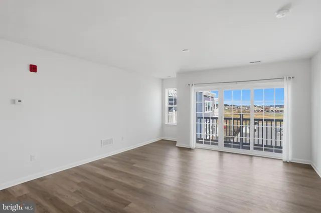 a view of a livingroom with wooden floor