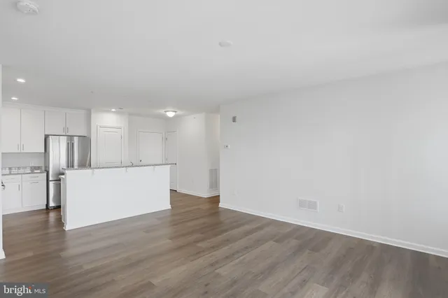 a view of kitchen with wooden floor