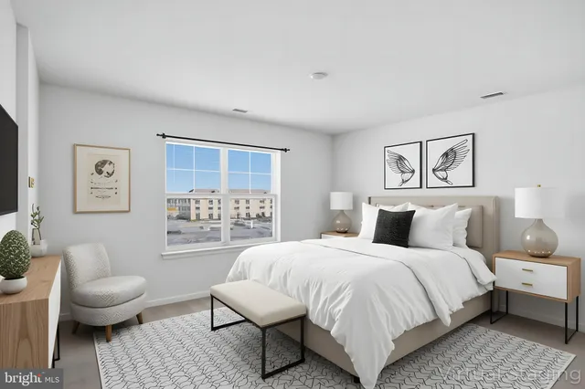 a bedroom with a bed and a couch