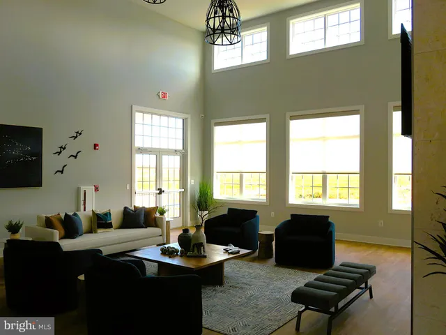 a kitchen with sink cabinets and wooden floor