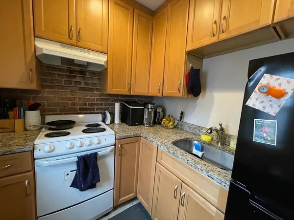 a kitchen with a stove and a sink