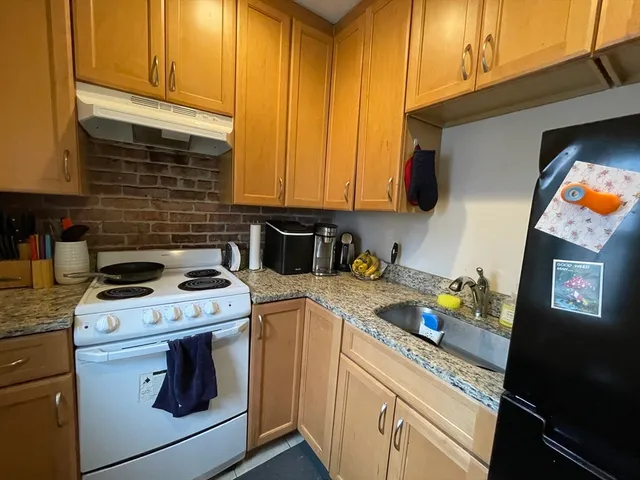 a kitchen with a stove and a sink