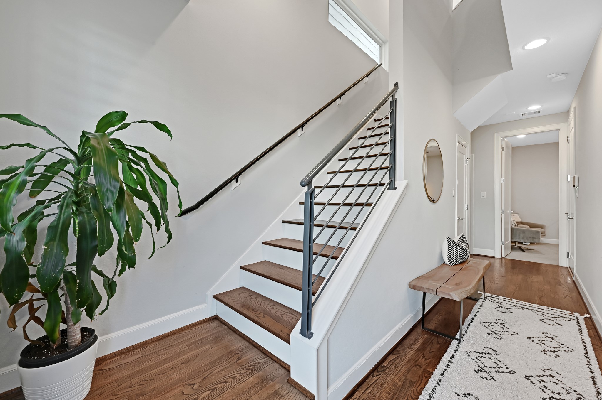 a view of entryway with wooden floor and stairs