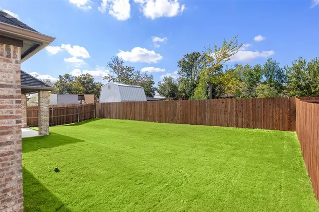 a view of a backyard with a garden