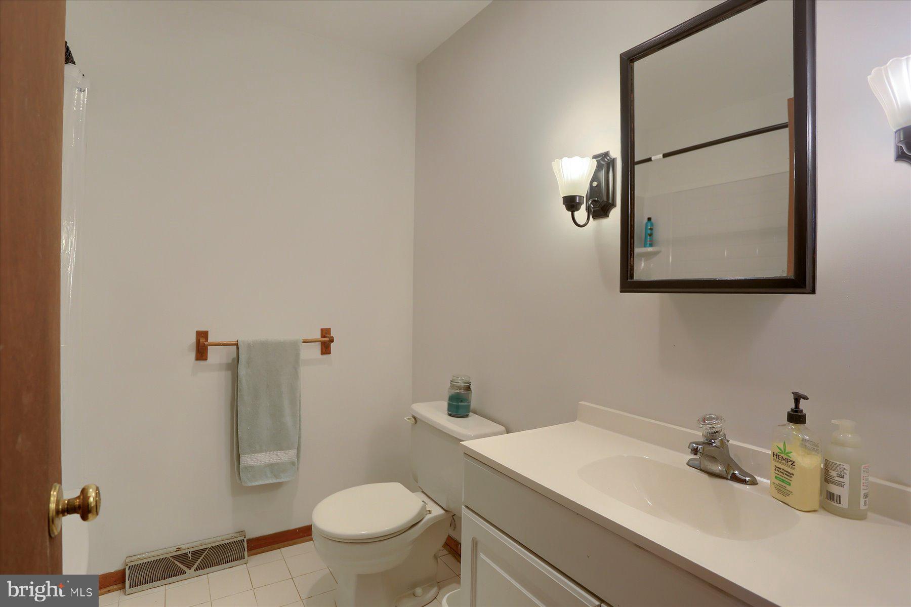 12 South Ridge Road Boiling Springs, PA 17007 - Photo 22 of 39 a bathroom with a sink toilet and mirror
