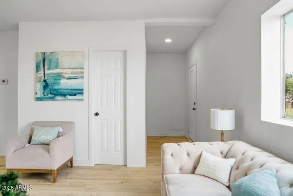 a living room with furniture and a window