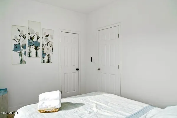 a bedroom with a bed and a table