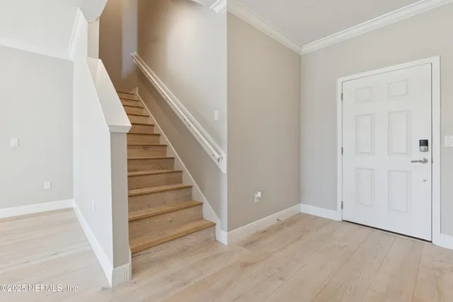 a white bath tub sitting next to a shower