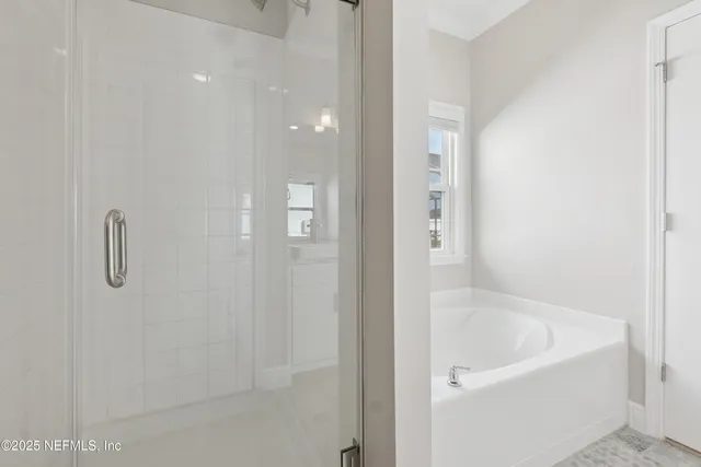a bathroom with a granite countertop sink a toilet and shower