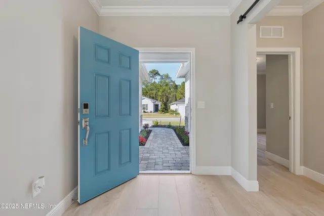 a view of entryway with wooden floor