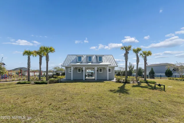 a view of a swimming pool with an outdoor space and seating area