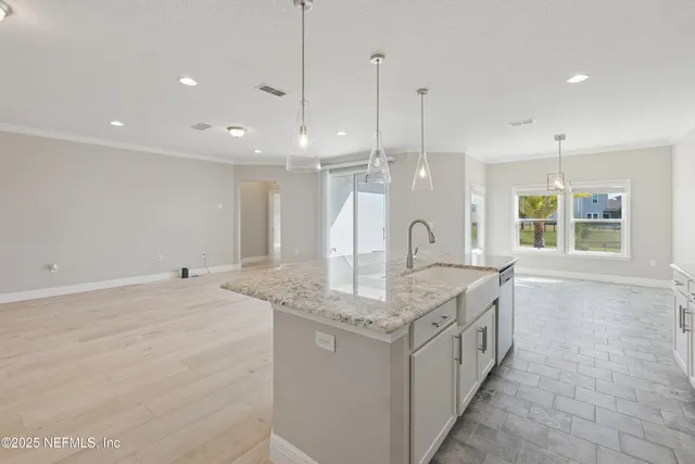 a bathroom with a granite countertop sink a large mirror and a shower