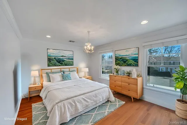 a bedroom with double bed and a window