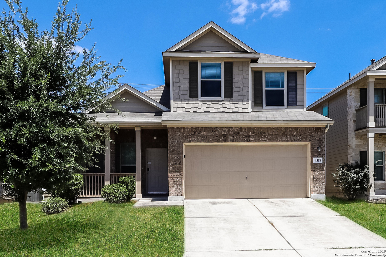a front view of a house with a yard