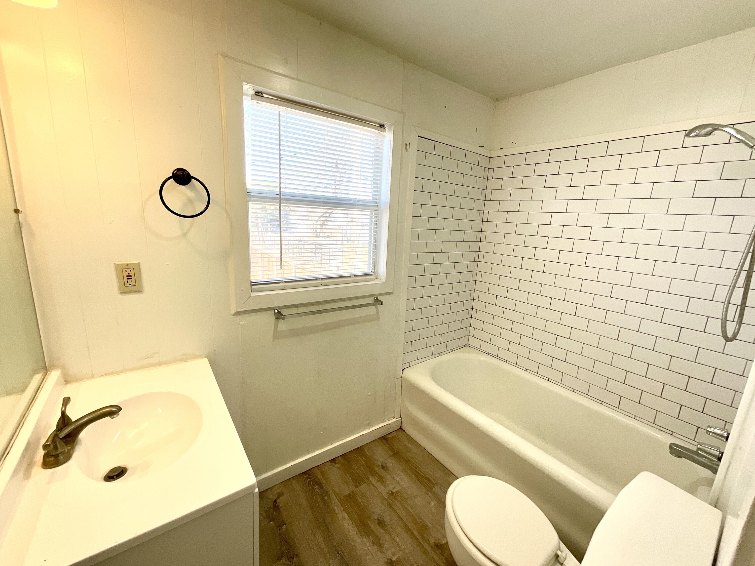 2004 30th Street Lubbock, TX 79411 - Photo 7 of 9 a bathroom with a sink toilet and shower