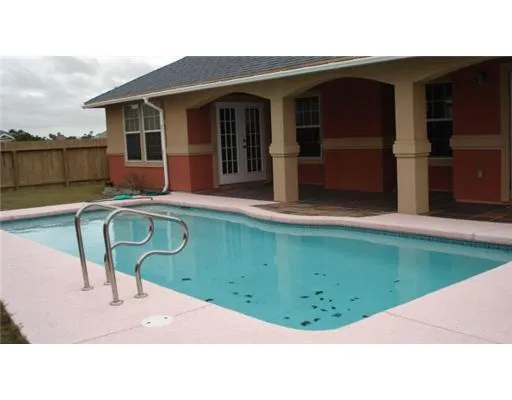 a picture of a table and chairs in the patio