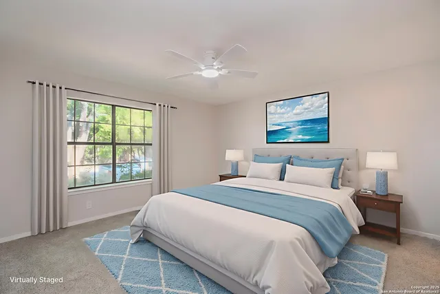 a bedroom with a large bed and a window