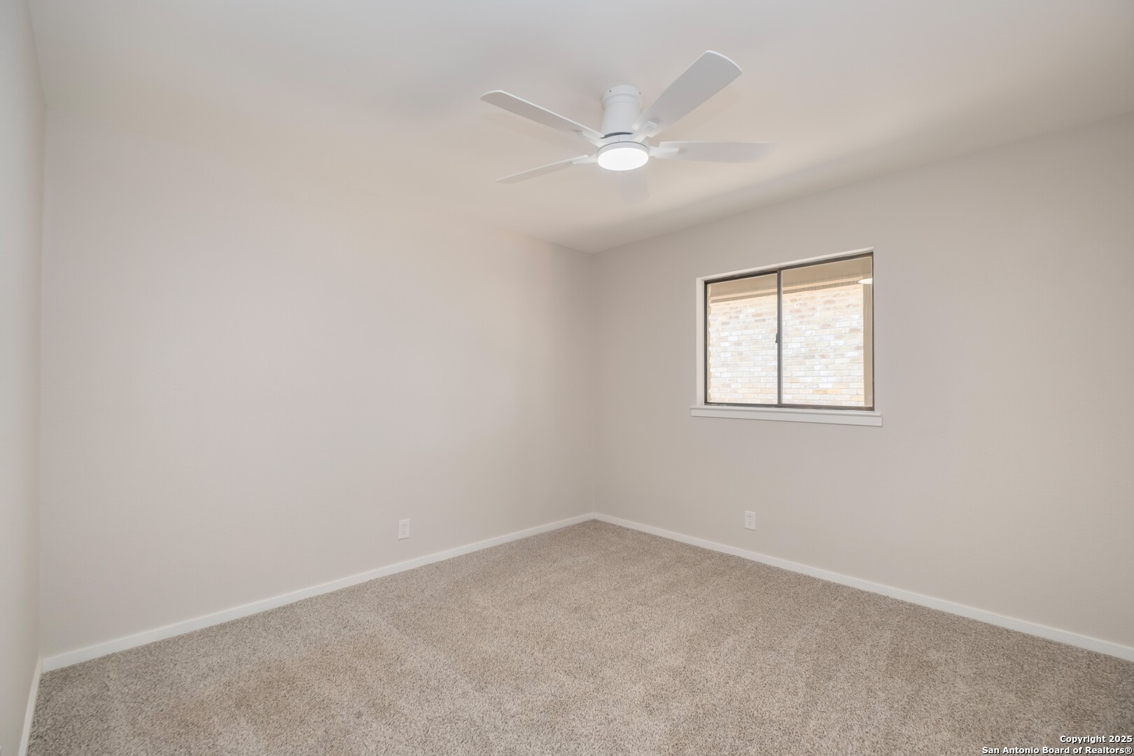 8906 Willmon Way Windcrest, TX 78239 - Photo 21 of 34 an empty room with a window
