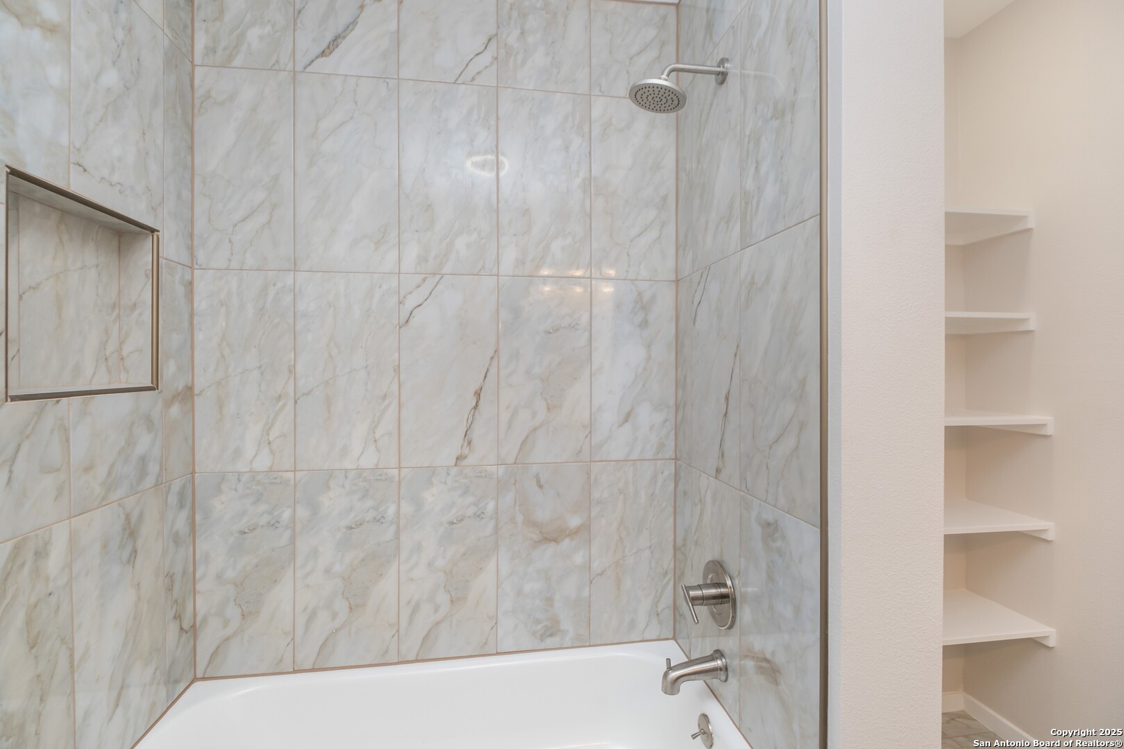 8906 Willmon Way Windcrest, TX 78239 - Photo 24 of 34 a bathroom with a bathtub