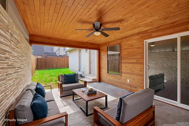 a outdoor living space with furniture and a fireplace