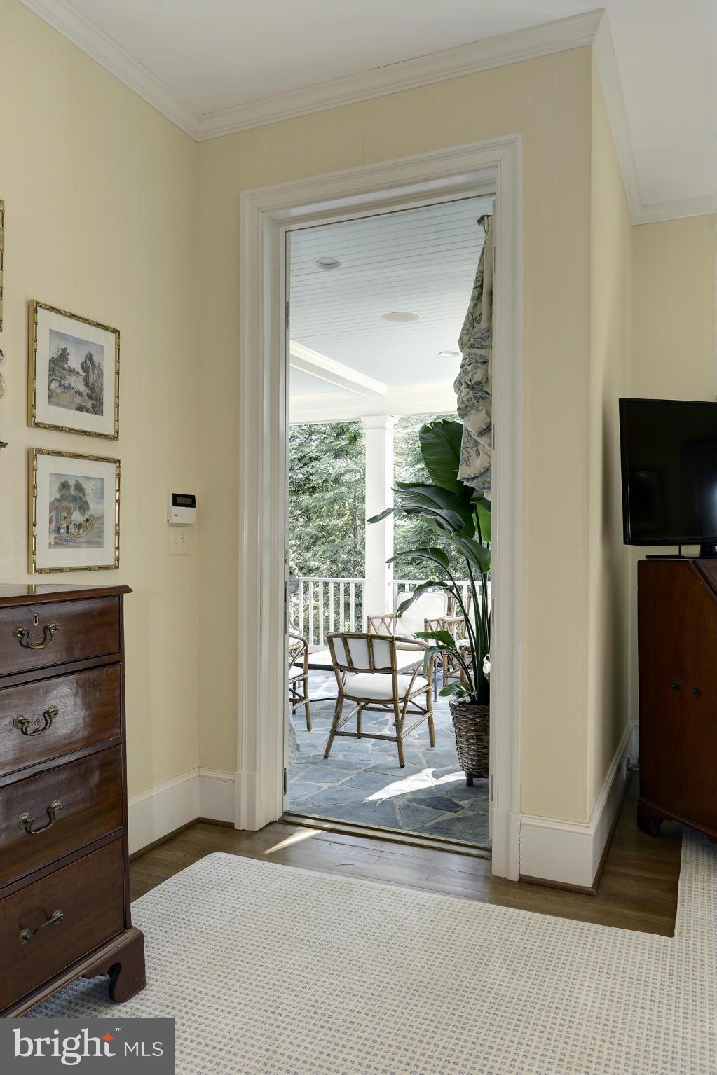 8106 Merrick Road Bethesda, MD 20817 - Photo 14 of 27 a living room with furniture and a flat screen tv