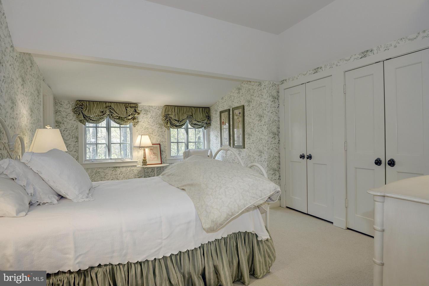 8106 Merrick Road Bethesda, MD 20817 - Photo 18 of 27 a bedroom with a bed and a large window