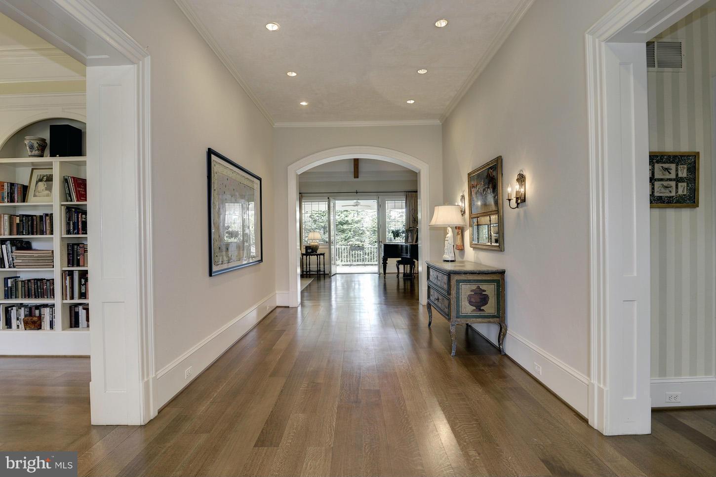 8106 Merrick Road Bethesda, MD 20817 - Photo 3 of 27 a view of a hallway with wooden floor windows and livingroom view