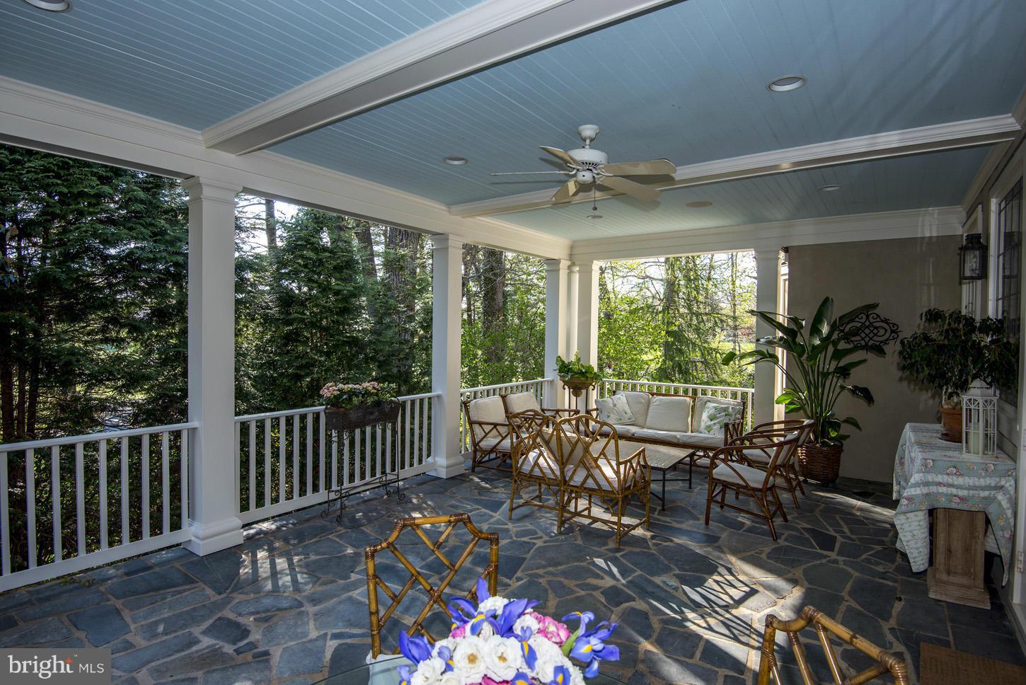 8106 Merrick Road Bethesda, MD 20817 - Photo 24 of 27 a view of a porch with chairs and backyard