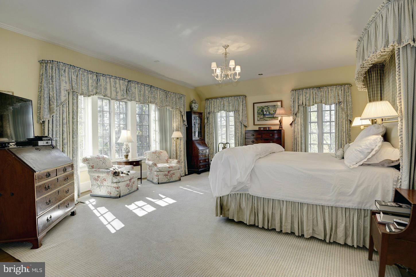 8106 Merrick Road Bethesda, MD 20817 - Photo 5 of 27 a large bedroom with bed and a large window