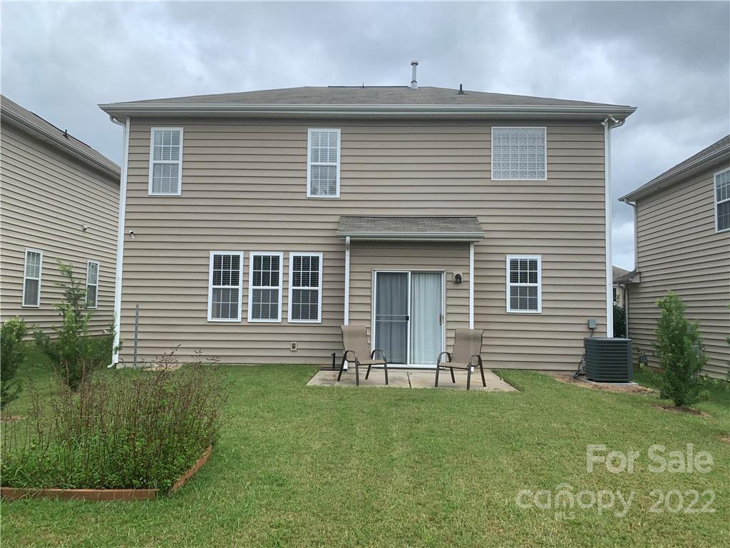 6518 Del Rio Road Charlotte, NC 28277 - Photo 16 of 19 a front view of a house with a yard