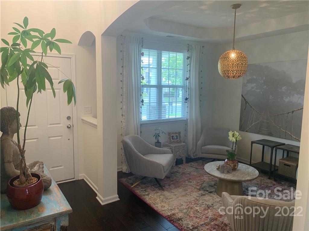 6518 Del Rio Road Charlotte, NC 28277 - Photo 2 of 19 a living room with furniture and a potted plant