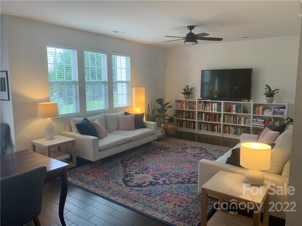 6518 Del Rio Road Charlotte, NC 28277 - Photo 3 of 19 a living room with furniture a flat screen tv and a large window