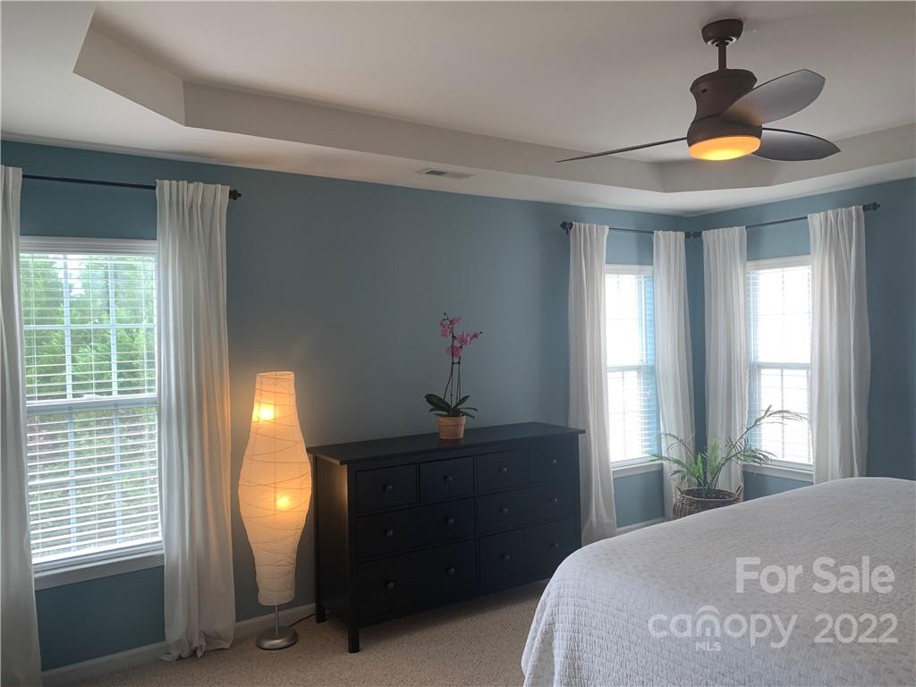 6518 Del Rio Road Charlotte, NC 28277 - Photo 8 of 19 a bedroom with a bed and a window