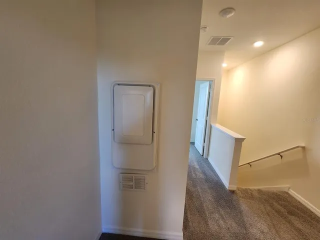 a view of a bedroom from a hallway