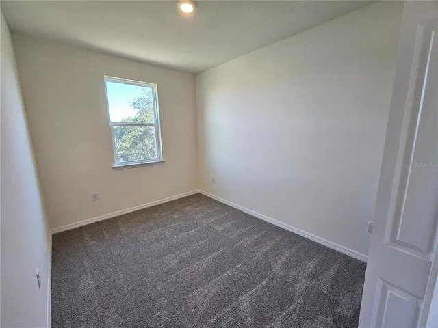 an empty room with a bathroom
