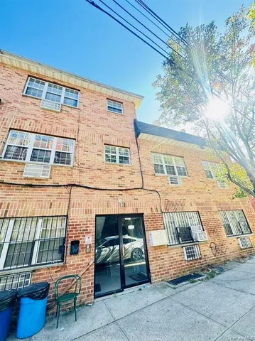 a view of a patio with a chairs and table in the patio