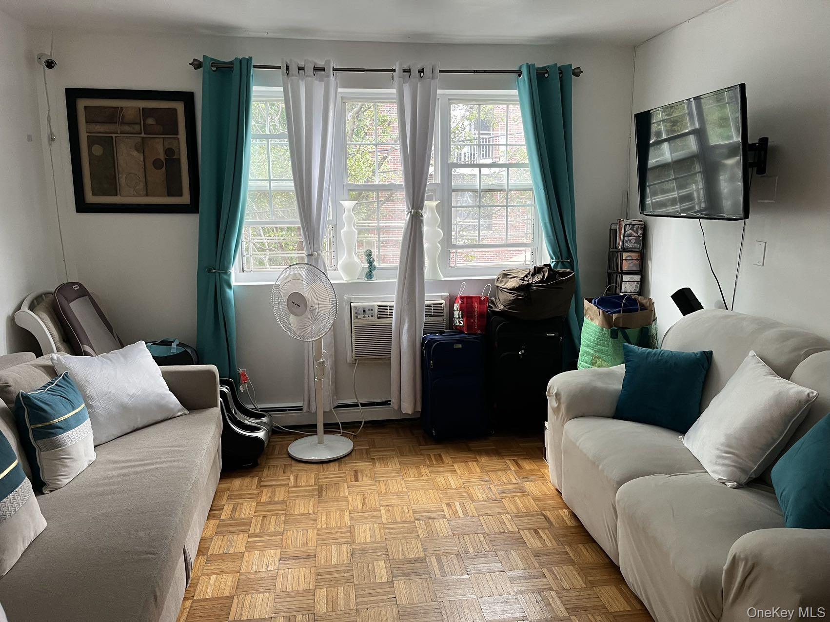 109-12 Westside Avenue Queens, NY 11368 - Photo 7 of 16 a living room with furniture