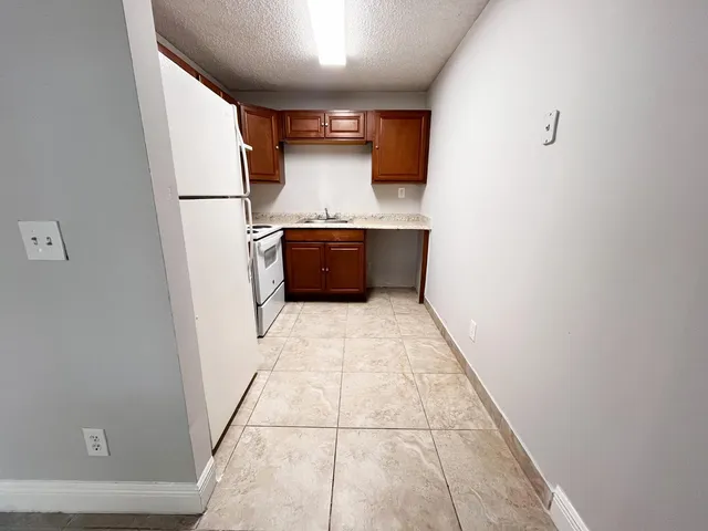 a view of kitchen with a sink