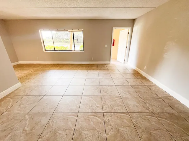 a view of an empty room and window
