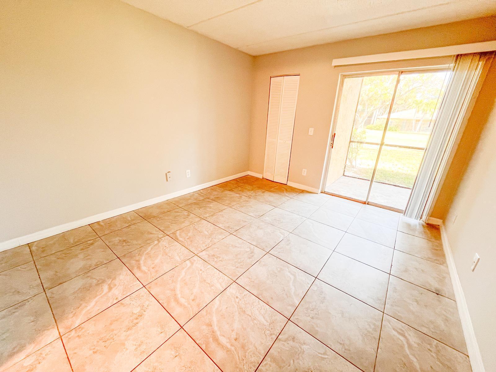 1106 Meadows Circle Boynton Beach, FL 33436 - Photo 8 of 16 a view of an empty room and window
