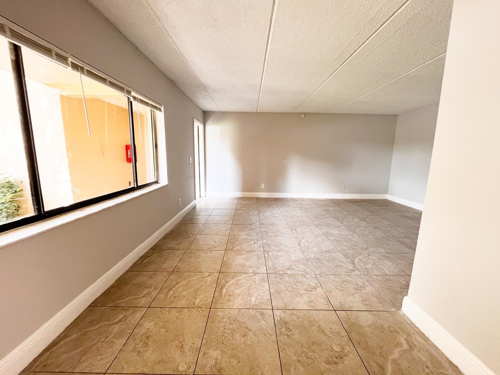 1106 Meadows Circle Boynton Beach, FL 33436 - Photo 9 of 16 a view of an empty room with a window