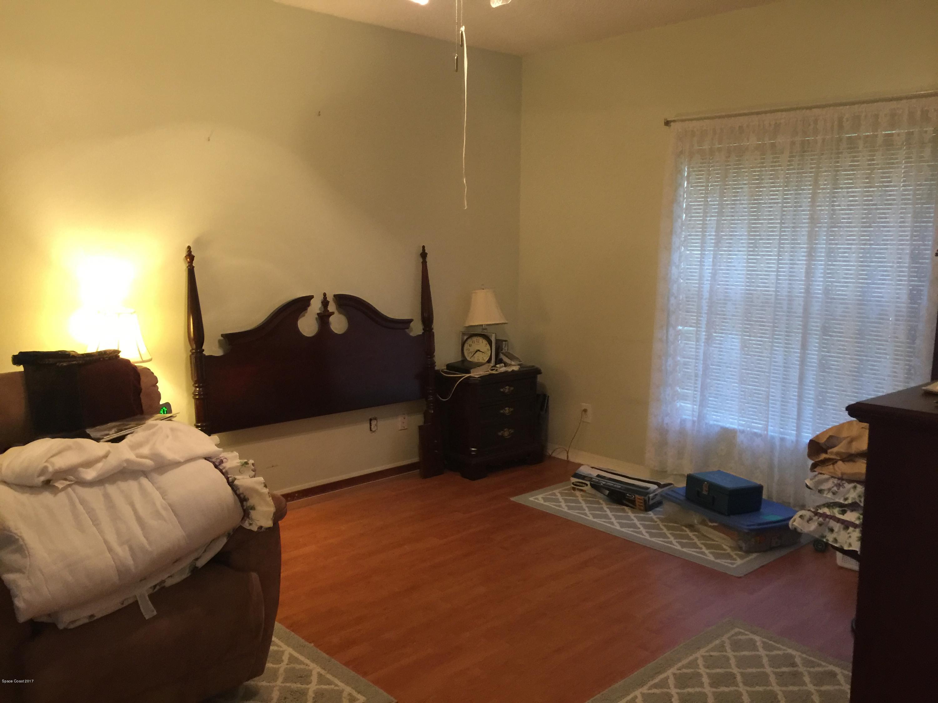 821 Raleigh Road Southeast Palm Bay, FL 32909 - Photo 7 of 11 Master Bedroom