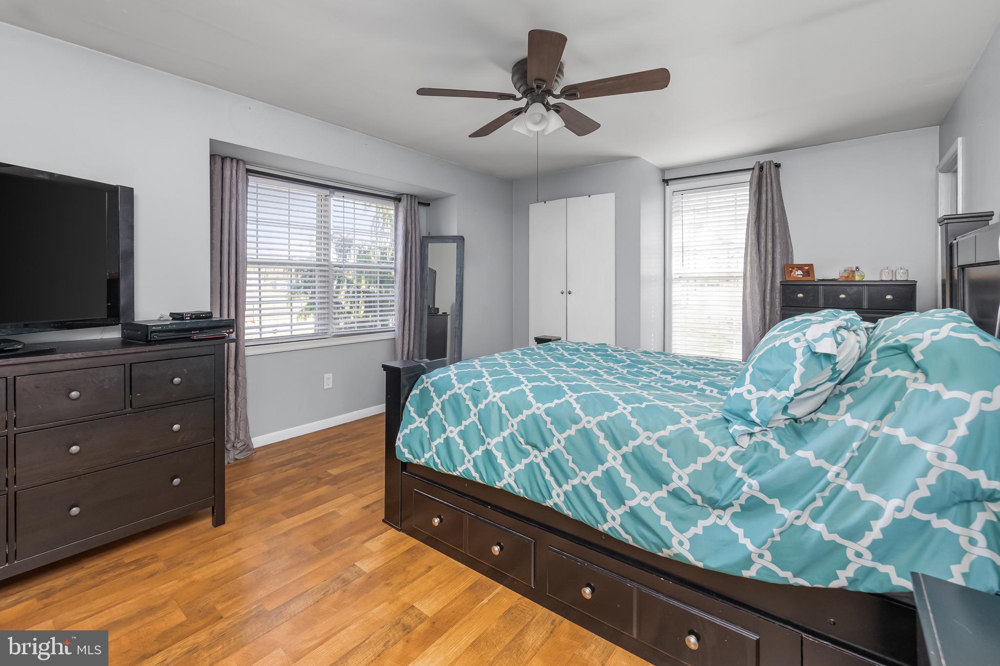 578 Eldridges Hill Road Pilesgrove, NJ 08098 - Photo 12 of 20 a bedroom with a bed and a flat screen tv