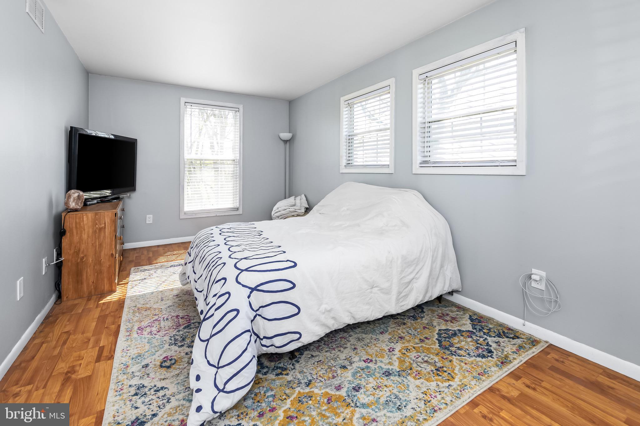 578 Eldridges Hill Road Pilesgrove, NJ 08098 - Photo 14 of 20 a bedroom with a bed and flat screen tv