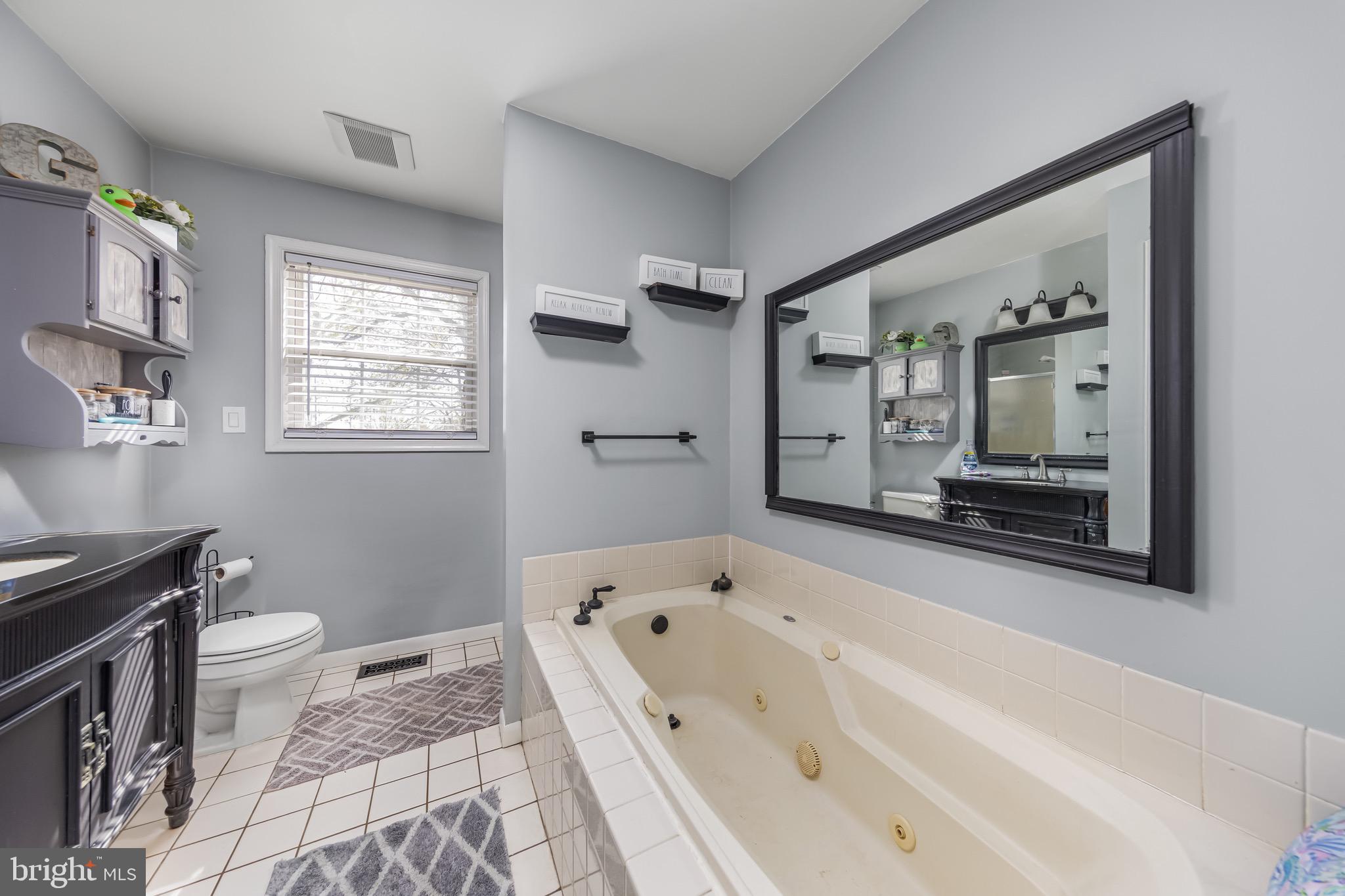 578 Eldridges Hill Road Pilesgrove, NJ 08098 - Photo 15 of 20 a bathroom with a bathtub sink and toilet