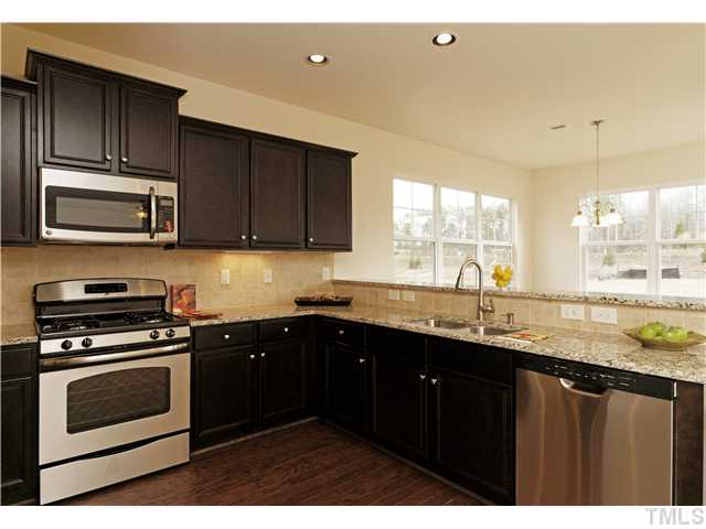 2337 Everstone Road Wake Forest, NC 27587 - Photo 5 of 25 Oversized breakfast bar! Recessed cans and under cabinet lighting provide plenty of light!!